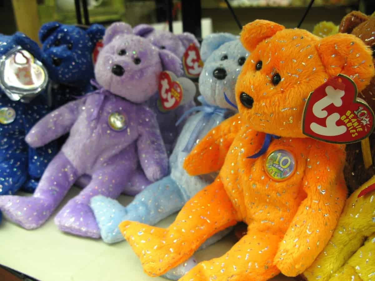 Several Beanie Babies placed on a shelf
