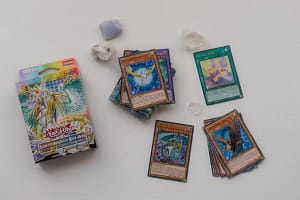 Yu-Gi-Oh cards on a table with the packaging